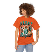 a woman wearing an orange t - shirt with an image of a basketball team