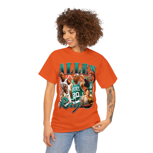 a woman wearing an orange t - shirt with an image of a basketball team