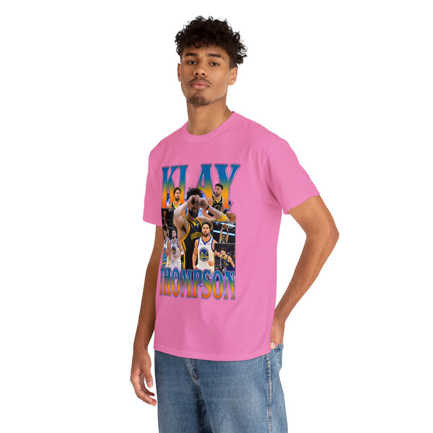 a young man wearing a pink t - shirt with a photo of a basketball player