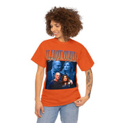 a woman wearing an orange t - shirt with a picture of two people on it