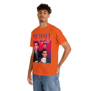 a man wearing an orange t - shirt with a picture of two men on it