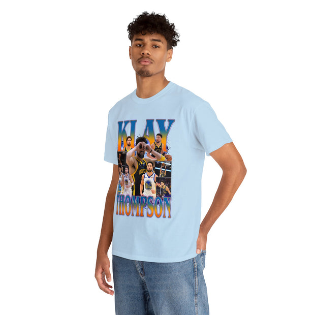 a young man wearing a blue t - shirt with a photo of a basketball player