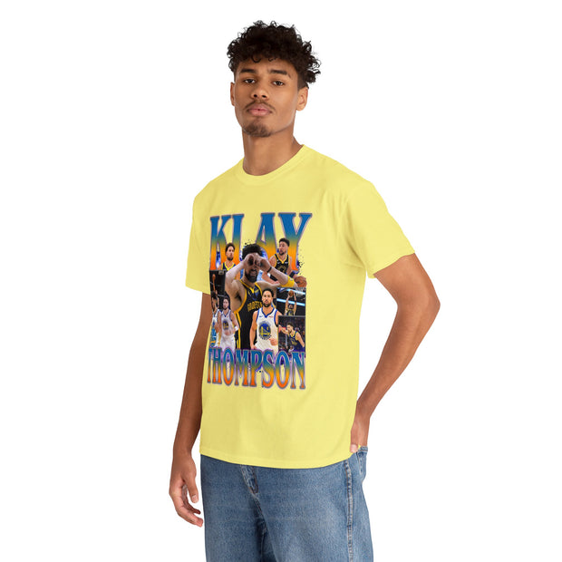 a young man wearing a yellow t - shirt with a photo of a basketball player