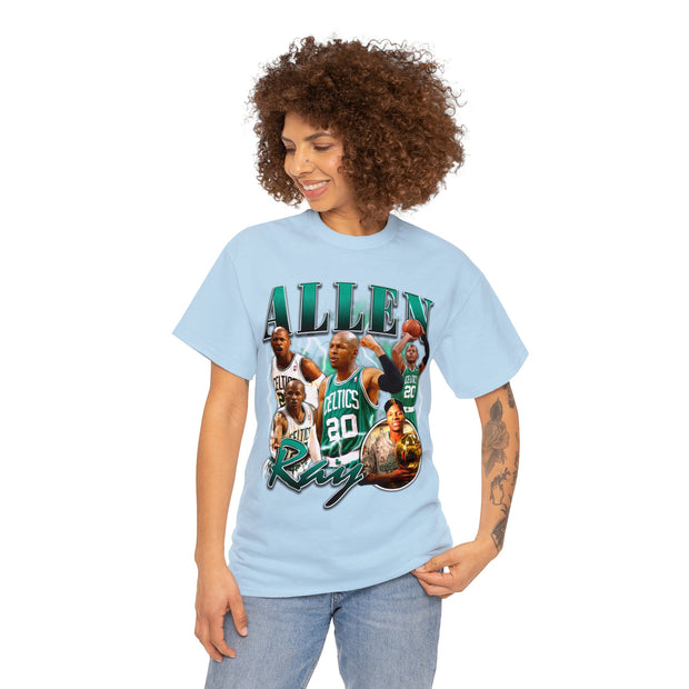 a woman wearing a light blue t - shirt with a picture of a basketball player