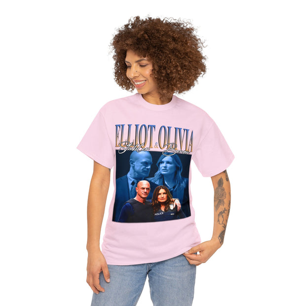 a woman wearing a pink t - shirt with a picture of two people on it