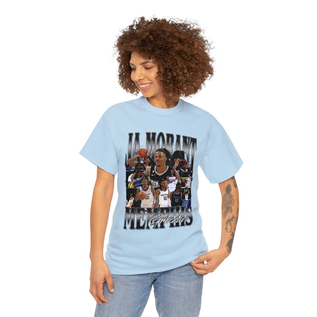 a woman wearing a light blue t - shirt with a picture of a basketball player