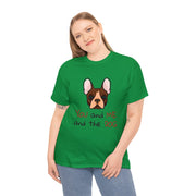 a woman wearing a green shirt with a dog on it